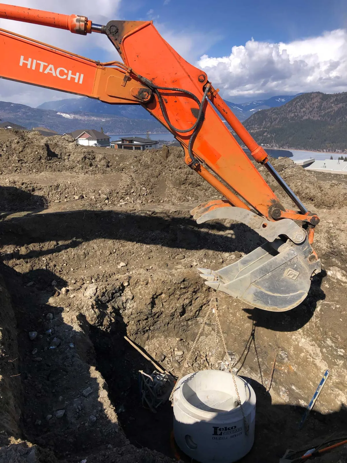 Road and utility servicing underway on a Highlands lot
