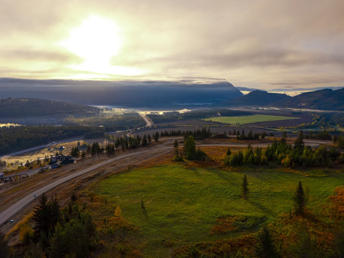 Sunrise haze over the Shuswap valley from the west side of The Highlands at Blind Bay, a summer home location outside the BC speculation tax area